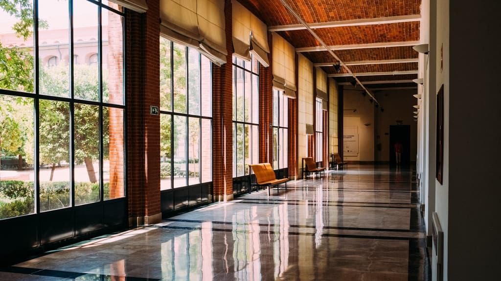 A clean, well-lit residential building corridor and shared communal area